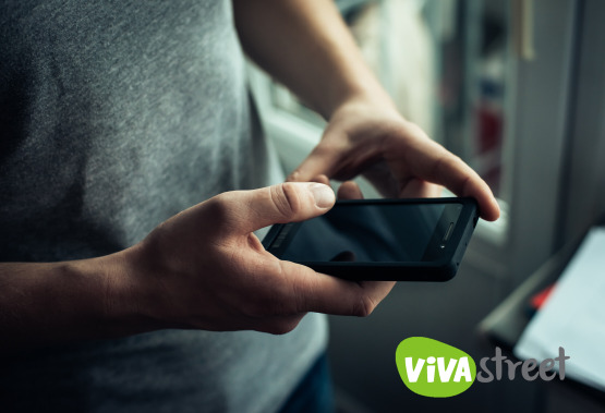 Man with phone & Vivastreet logo